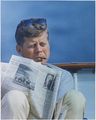 Hyannisport Weekend. President Kennedy with cigar and New York Times. Hyannisport, MA, aboard the Honey Fitz-NARA-194268.jpg