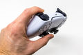 Close-Up of Person holding a Sony PlayStation DualSense Wireless Controller on White Background-Flickr.jpg