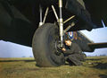 0Testing the tyre pressure of Avro Lancaster R5540 of No 44 Squadron Conversion Flight at Waddington, Lincolnshire.jpg