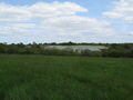 NE across field to some very large barns or storage units - geograph.org.uk - 1286098.jpg