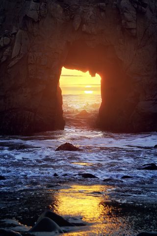 Pfeiffer Beach in Big Sur, California. This beach is famous for the keyhole, a hole in a rock out on the ocean.