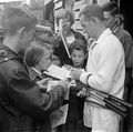 Rod Laver signing autographs Dutch Championships 1962.jpg
