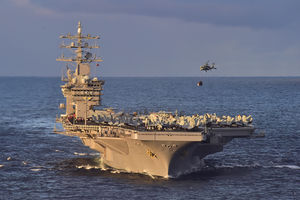 Bow view of USS Dwight D. Eisenhower (CVN-69) with HSC-7 MH-60S Sea Hawk helihoisting cargo during underway replenishment 151129-N-QD363-561.jpg